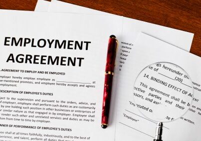 Employment agreement papers on the table